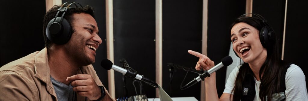 https elements.envato.com portait of two happy radio hosts young man and wom 23V4MSD 2.jpg