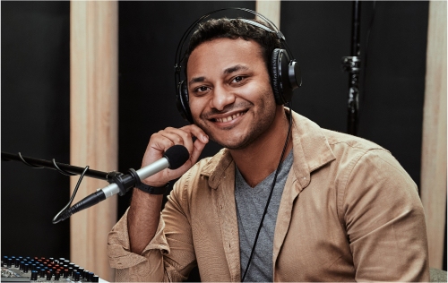 https elements.envato.com portrait of happy young male radio host having a d WJX7EZQ 1.jpg